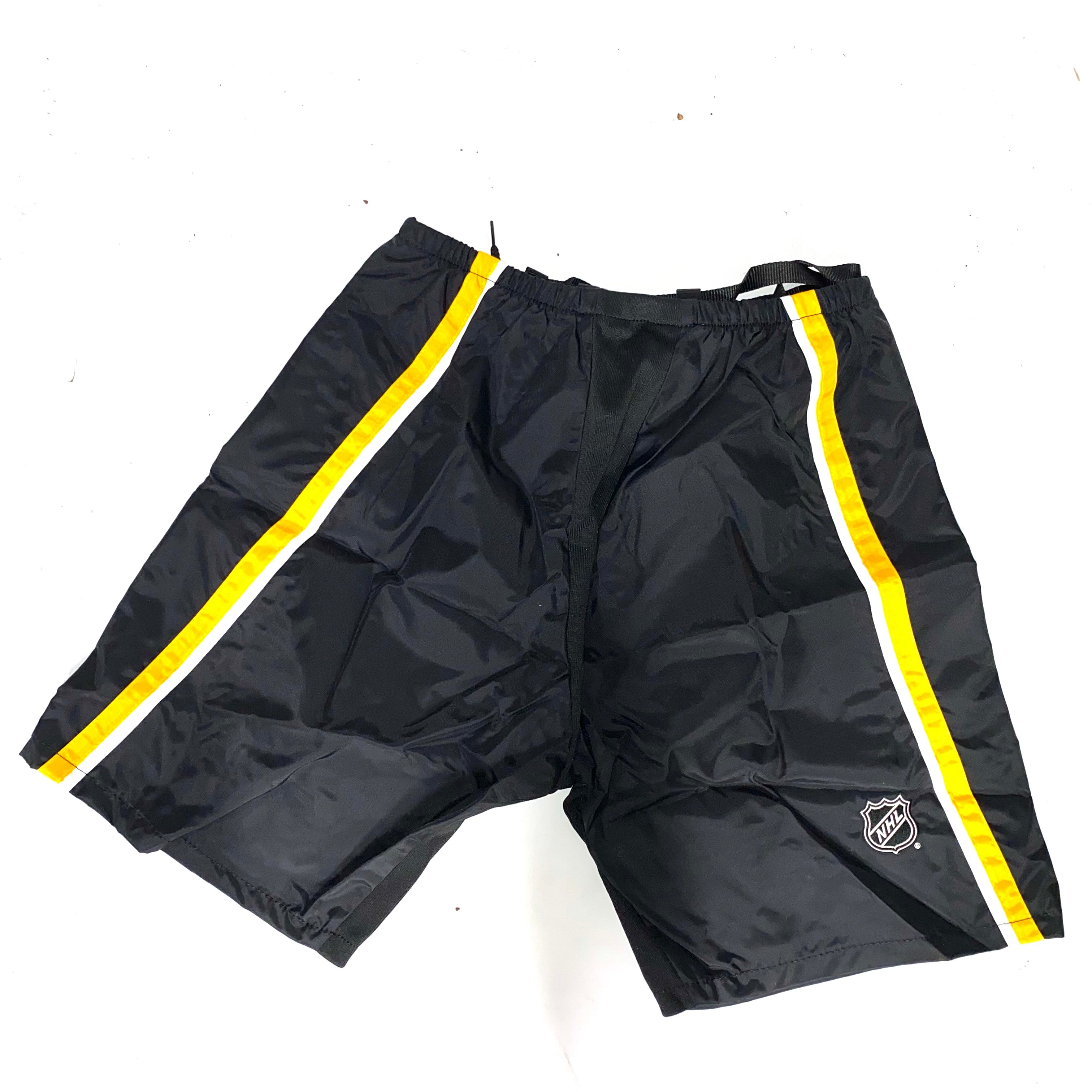CCM PP10 - Nouvelle coque de pantalon NHL Pro Stock - Flames de Calgary (noir/jaune/blanc)